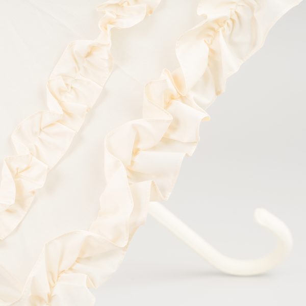 Elegant ivory wedding umbrella with double frilled design for special occasions.