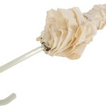 Close-up of ivory wedding umbrella handle with frilled fabric and curved hook.