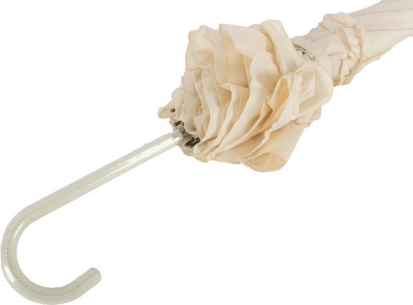 Close-up of ivory wedding umbrella handle with frilled fabric and curved hook.