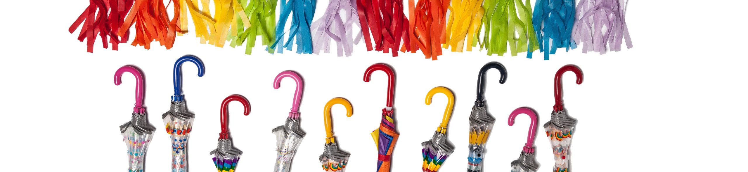 Vibrant collection of umbrellas with colourful handles and patterns.